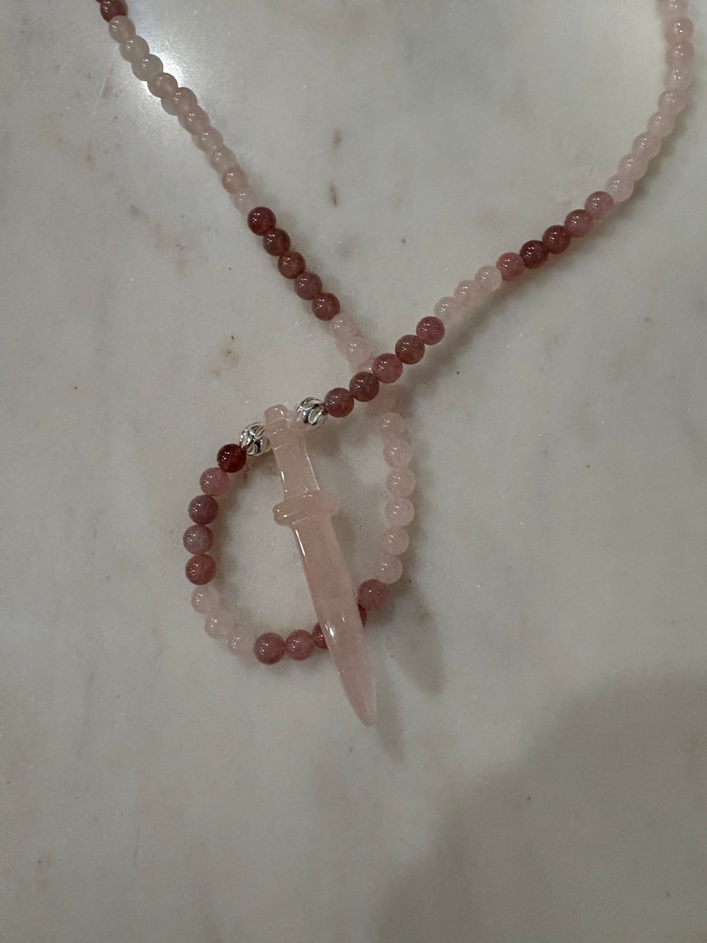 Rose quartz necklace featuring rose, quartz sword