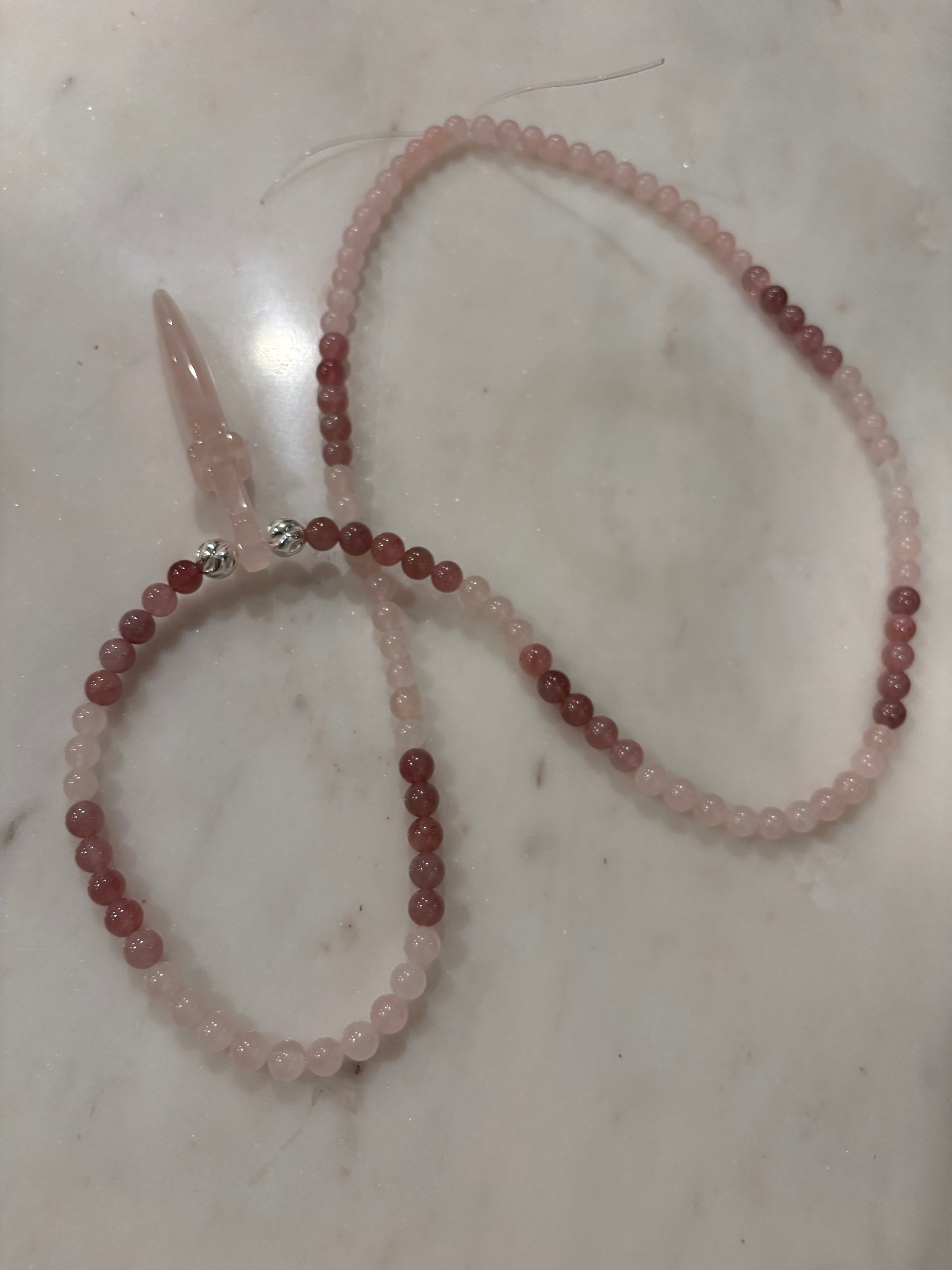 Rose quartz necklace featuring rose, quartz sword